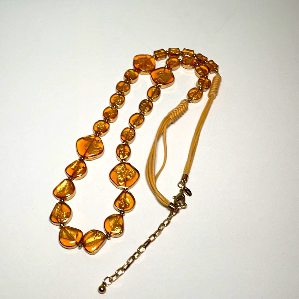 Chico’s amber resin and gold leaf corded necklace